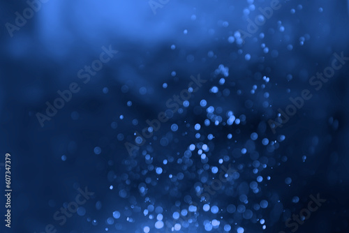 Abstract navy blue blurred bokeh glitter background Ideal as wallpaper, banner, Christmas theme, brochure etc.,