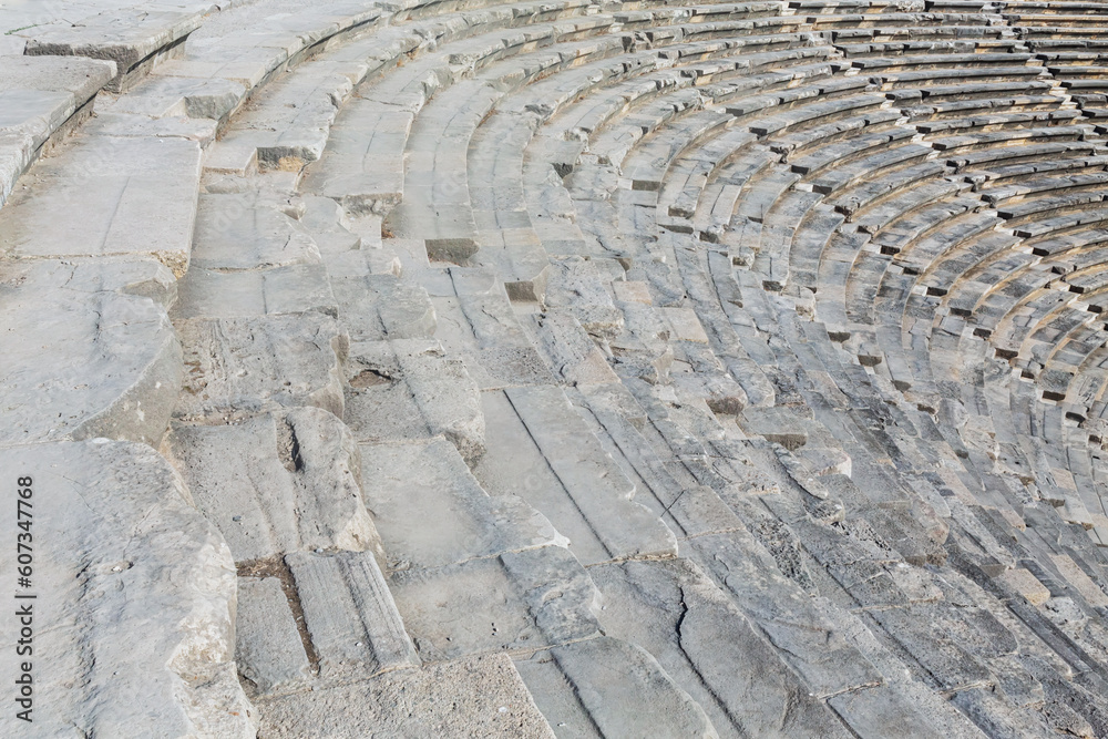 Ruins of old theater in Side, Turkey (Turkiye). Close up fragment of marple spectators seats Ruins of old theater in Side, Turkey (Turkiye). Close up fragment of marple spectators seats