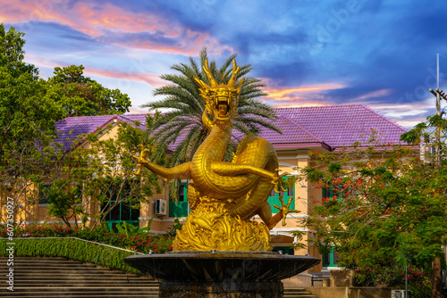 Golden dragon in old phuket town phuket Thailand this dragon is on the middle of a big water pond and fountain Chinese Dragon photo