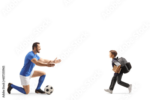 Schoolboy running to hug a football player