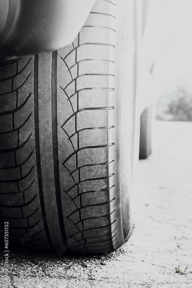Obraz premium Car wheels on a background of asphalt. Car tires