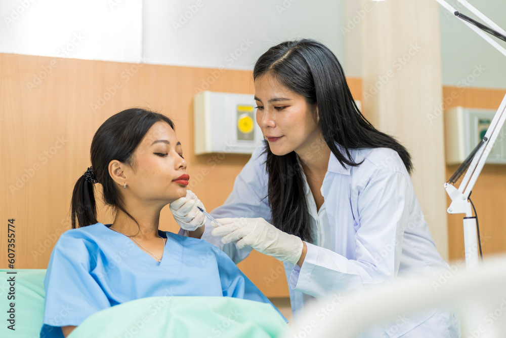 Asian woman consulting about Cosmetic surgeon and make Botox injections on face for beauty procedures. Plastic surgery in face of woman Asian woman consulting about Cosmetic surgeon and make Botox injections on face for beauty procedures. Plastic surgery in face of woman