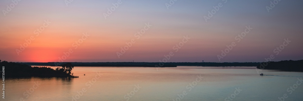 Panoramic shot of a lake landscape at dusk
