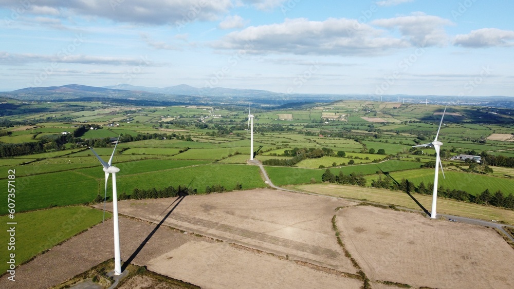 Aerial view of windmills in farmland