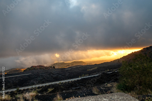 View of the volcanic rocks and road to Mount Etna in Sicily