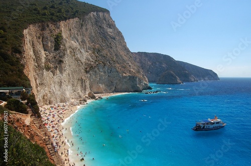 Scenic shot of the cliffs and the Porto Katsiki beach packed with tourists in Lefkada, Greece photo