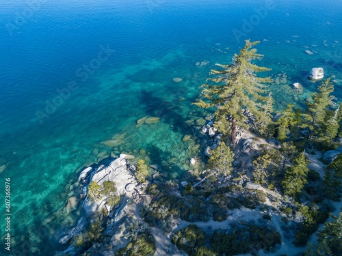 Aerial view of the lake Tahoe with trees on a sunny day in the Sierra Nevada of the United States © James Luo/Wirestock Creators