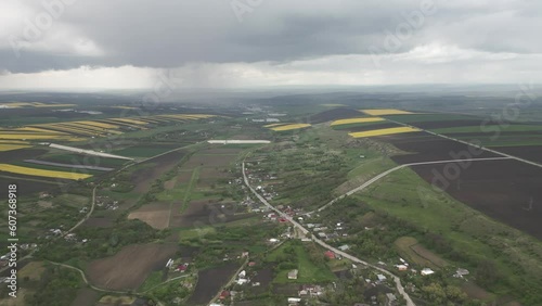 Tremendous agricultural field puzzled in parcels, storm on it´s way photo