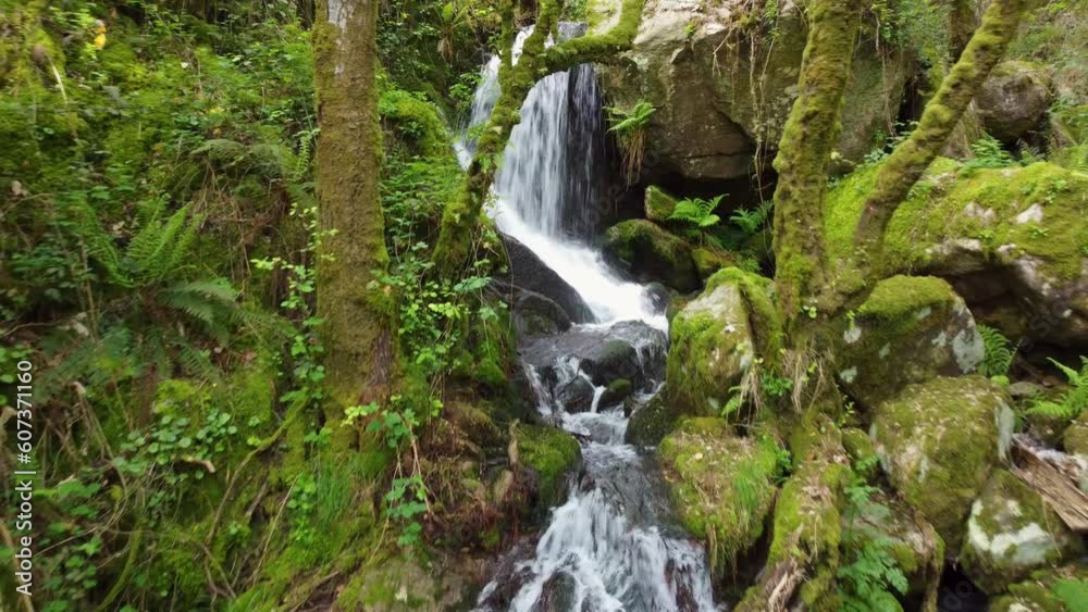 Waterfall at the arrival of tributaries to the Sil river canyon at the height of Peares, Ourense, Galicia, Spain Waterfall at the arrival of tributaries to the Sil river canyon at the height of Peares, Ourense, Galicia, Spain