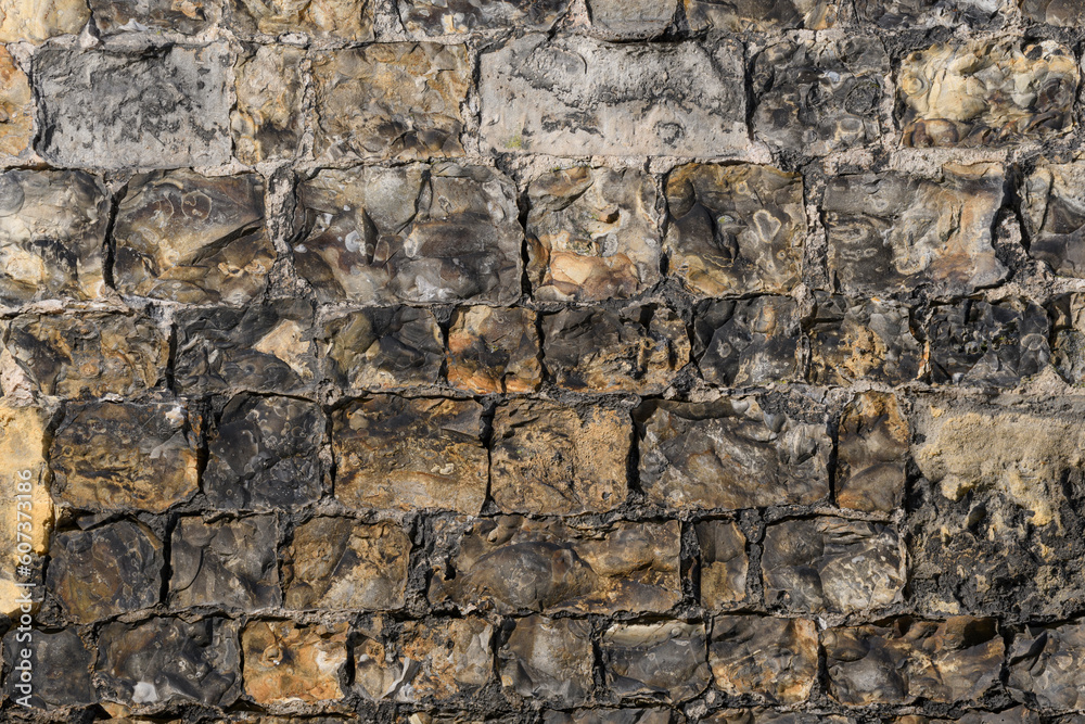 Stone laying of the wall of an ancient castle. Texture