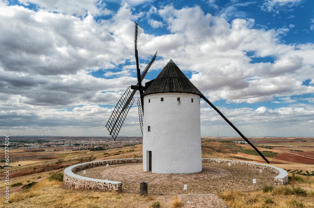 Windmill against a cloudy sky in Castilla-La Mancha, Spain Windmill against a cloudy sky in Castilla-La Mancha, Spain