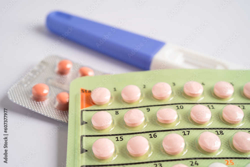 Pregnancy test and birth control pills on calendar, contraception health and medicine. Pregnancy test and birth control pills on calendar, contraception health and medicine.