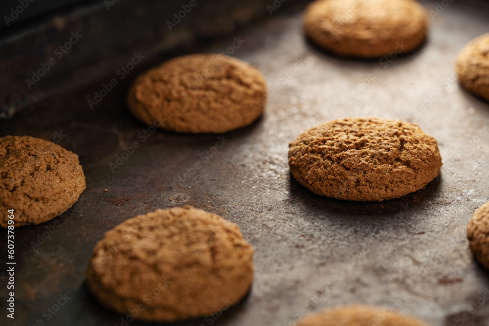 Oatmeal cookies on baking sheet. Fresh sweet pastries for tea. Homemade oatmeal sweets. Oatmeal cookies on baking sheet. Fresh sweet pastries for tea. Homemade oatmeal sweets.