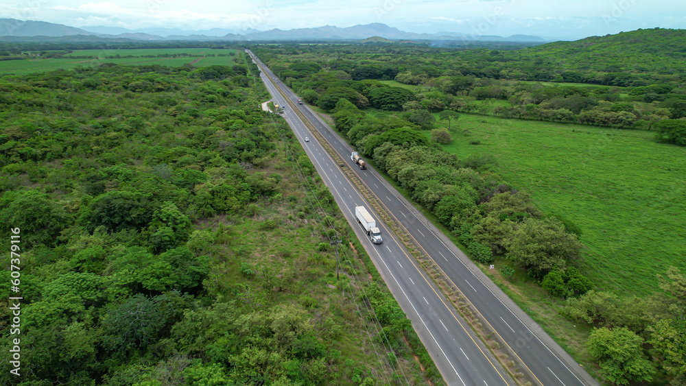 AERIAL Pan-American Highway stretching along scenic tropical landscape of Panama