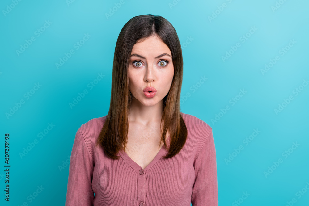 Photo of impressed optimistic girl with straight hairdo dressed pink cardigan plump lips staring isolated on blue color background