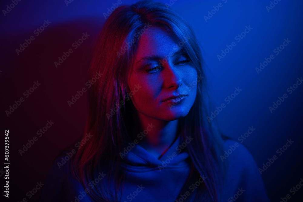 Colorful close-up studio portrait of a young woman