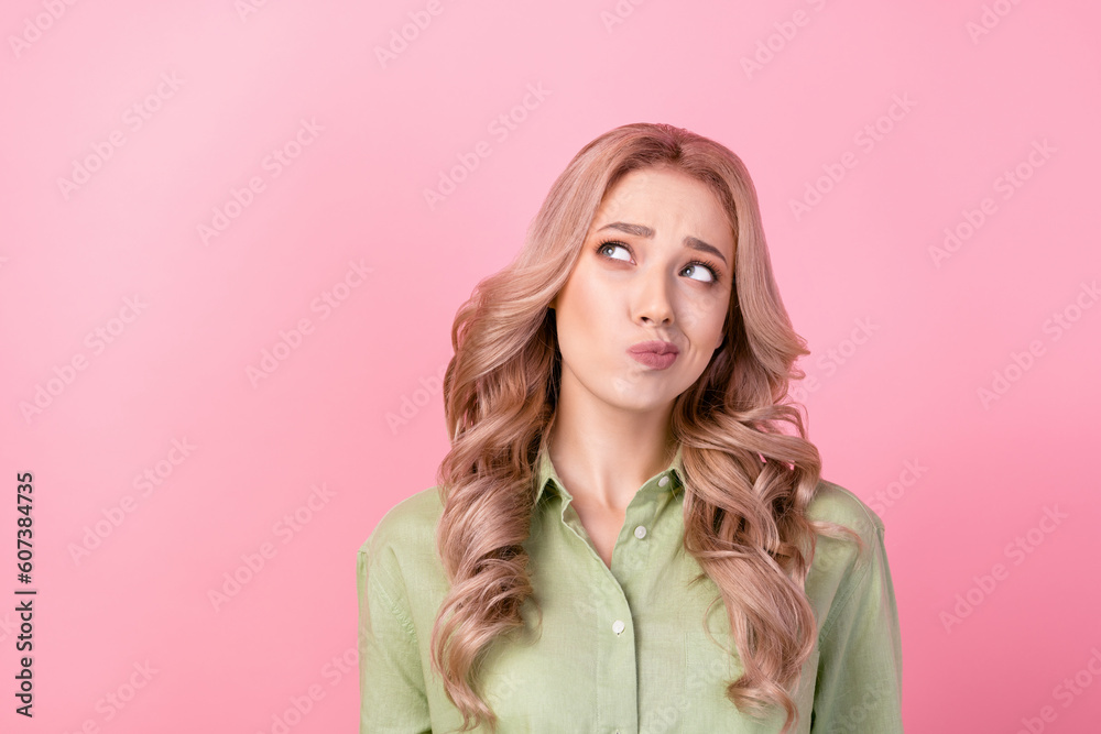 Photo of creative lady look empty space contemplate hesitate isolated on pink color background Photo of creative lady look empty space contemplate hesitate isolated on pink color background