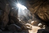huge boulders and rubble filling the entrance of a mountain cave, with sunlight shining through, created with generative ai
