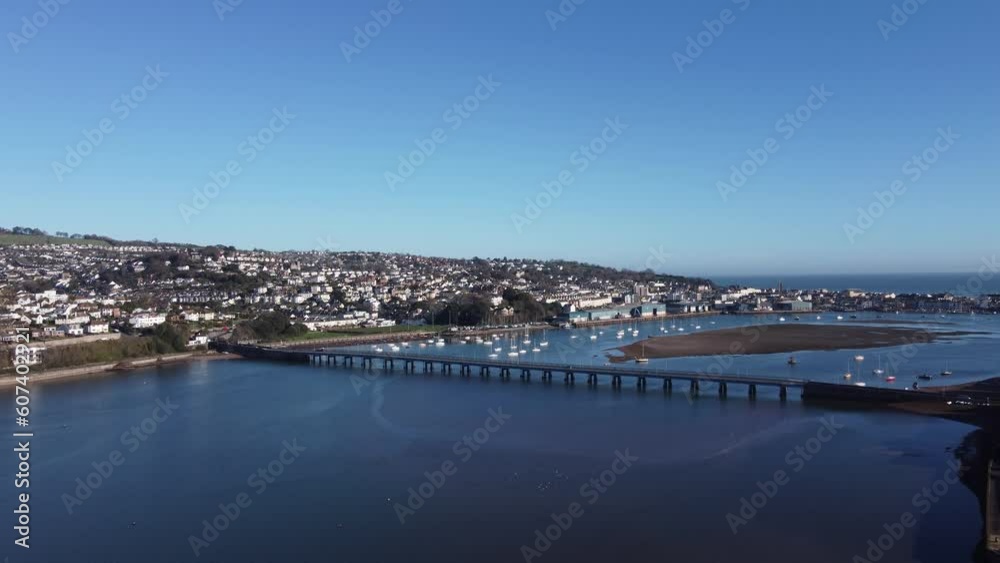 Teignmouth, South Devon, England: DRONE AERIAL VIEWS: The drone flies towards the River Teign bridge, Teignmouth Docks and the seaside town of Teignmouth. Teignmouth, South Devon, England: DRONE AERIAL VIEWS: The drone flies towards the River Teign bridge, Teignmouth Docks and the seaside town of Teignmouth.