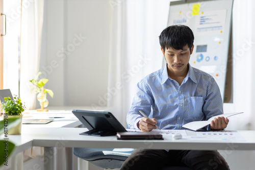 Businessman in casual clothes working alone in the office.
