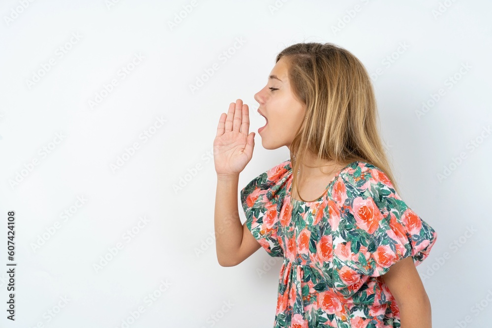 Half-faced close up portrait of astonished amazed MODEL holding hand near mouth Half-faced close up portrait of astonished amazed MODEL holding hand near mouth