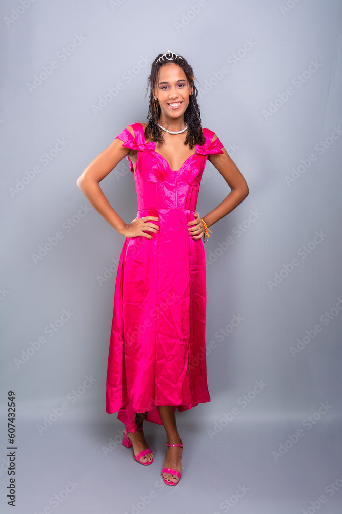 Teenage girl, beautiful, happy, standing wearing pink color dress. Teenage girl, beautiful, happy, standing wearing pink color dress.