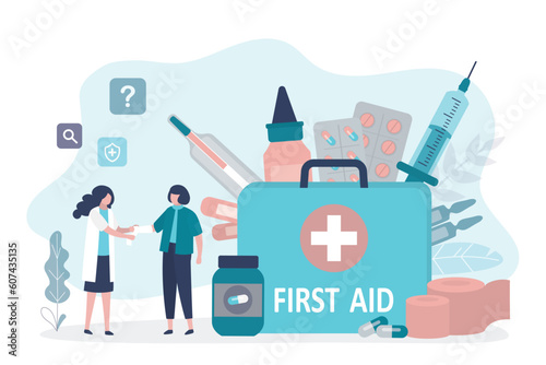 Big first aid bag. Doctor provides first aid to the injured woman. Unhappy patient with fracture or injury to arm, nurse applies bandage or plaster. Emergency, traumatology