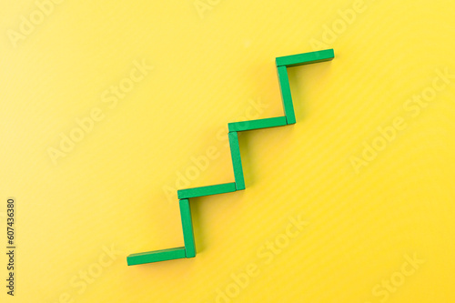 Steps to success. Green steps on yellow background.
