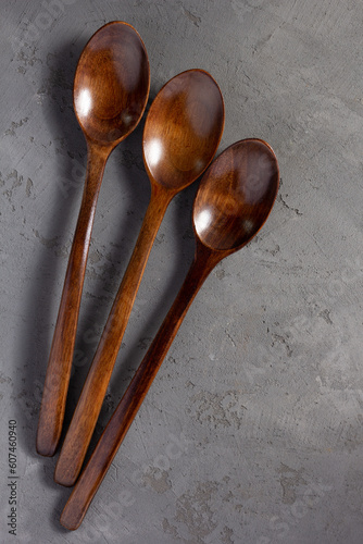 emty wooden spoon at concrete stone table background
