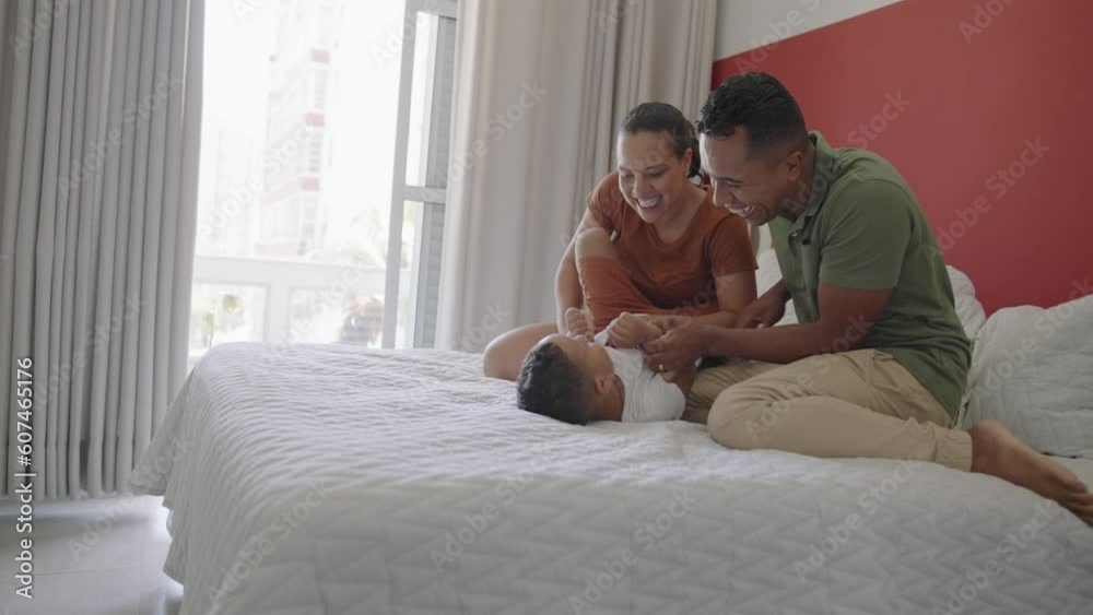 Happy family father and mother lays with kid daughter having fun enjoying weekend sunny morning in bed, carefree adorable small child playing with parents in modern bedroom
Happy family father and mother lays with kid daughter having fun enjoying weekend sunny morning in bed, carefree adorable small child playing with parents in modern bedroom