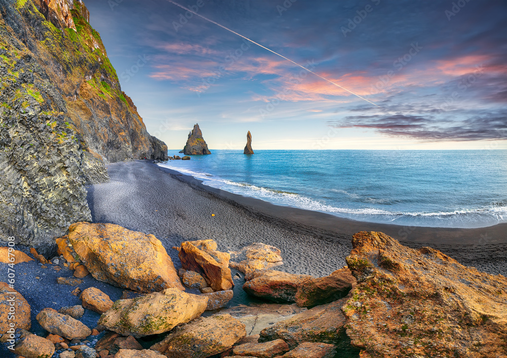Breathtaking view of rock formations Troll Toes on Black beach Reynisfjara near the village of Vik.