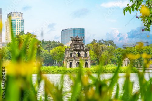 Hoan Kiem Lake ( Ho Guom) or Sword lake in the center of Hanoi in the morning. Hoan Kiem Lake is a famous tourist place in Hanoi. Travel and landscape concept.
