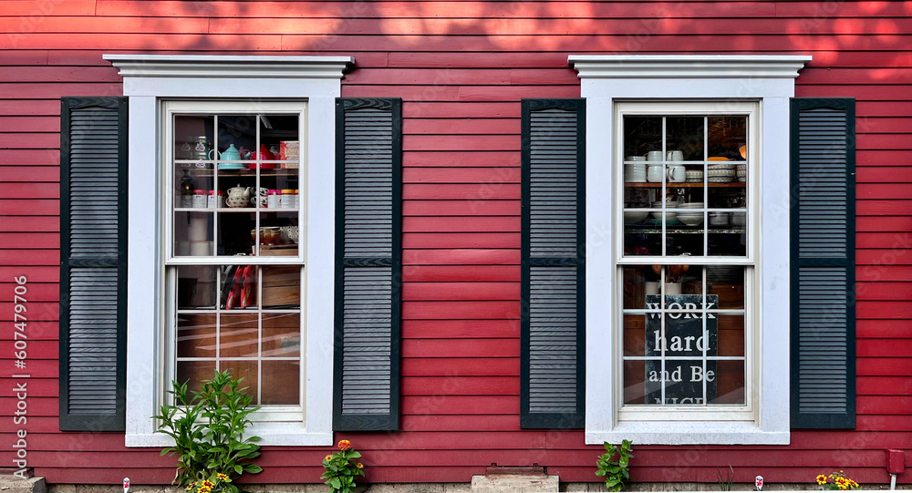 windows in historic red building (shopping, siding, glass, moldings, decorative) vintage hotel (inn, bed and breakfast) travel tourism