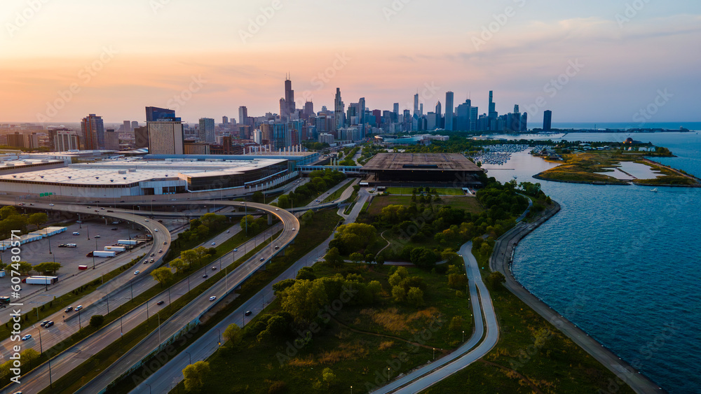 aerial drone view of Chicago metropolis from the lake during sunset.  the beautiful skyscraper showcases of the wonders of the city architecture. related to business finance and travel 