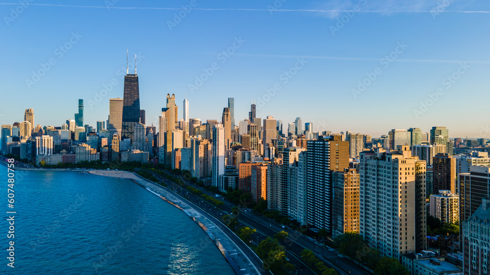 Obraz premium aerial drone view of Chicago metropolis from the lake during high noon. the beautiful skyscraper showcases of the wonders of the city architecture. related to business finance and travel 