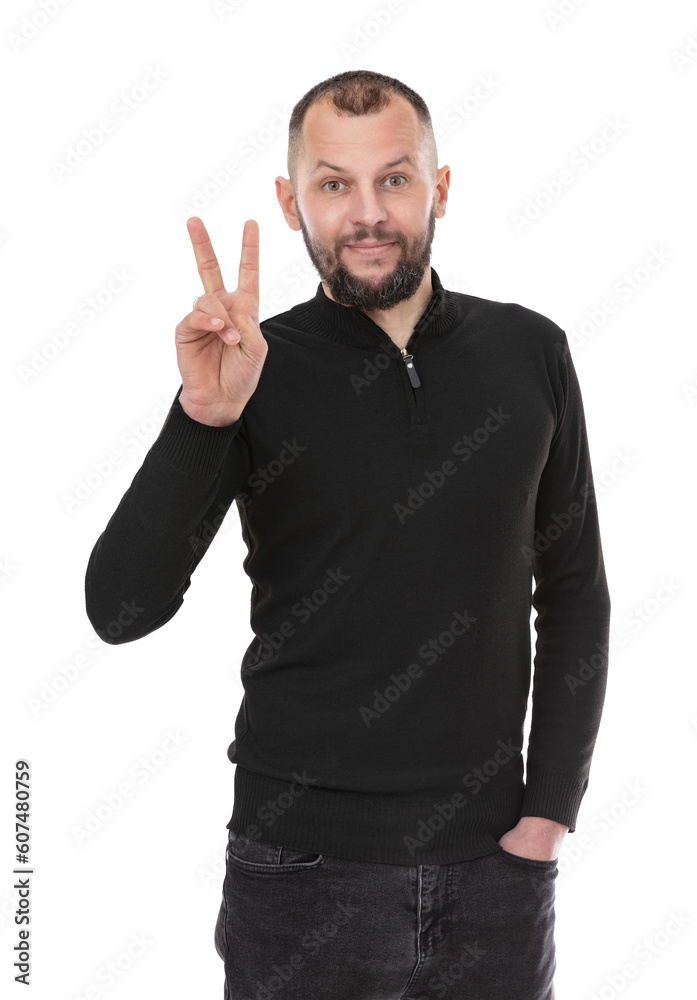 Portrait of thirty year old man shows v-sign symbol of peace with fingers, isolated on white background. Bearde caucasian man in blackturtleneck doing victory sign and smiling to the camera.