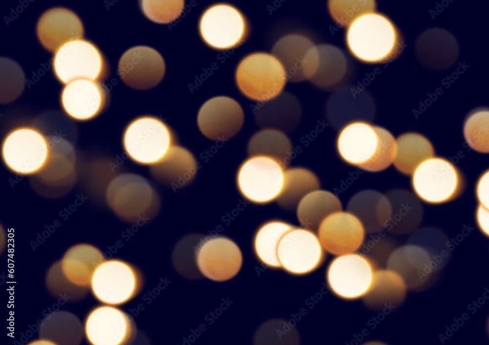 Fototapeta premium Blurred bright light bokeh on black background.