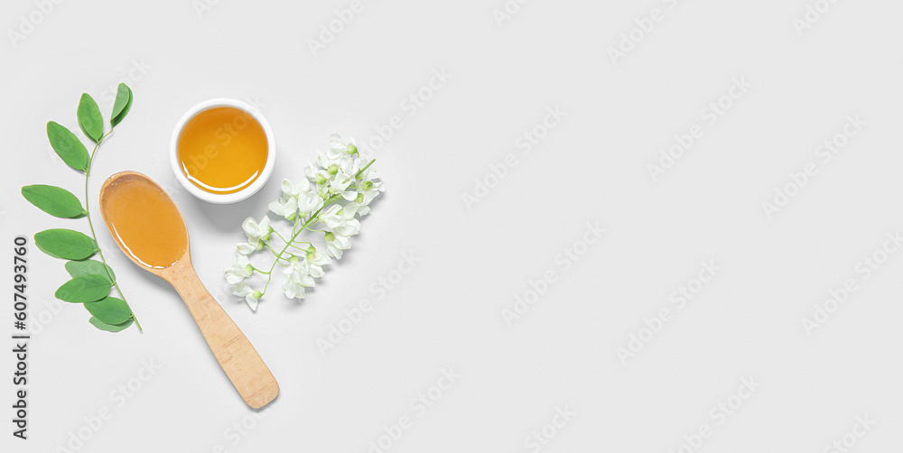 Composition with sweet honey and acacia flowers on white background with space for text, top view Composition with sweet honey and acacia flowers on white background with space for text, top view
