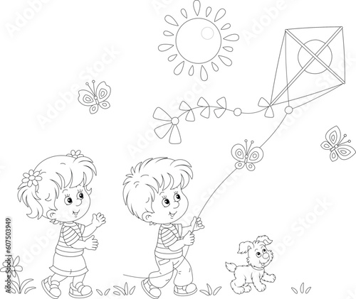 Happy little girl and boy with their merry pup playing with a flying colorful kite on a sunny summer day in a park, black and white vector cartoon illustration for a coloring book