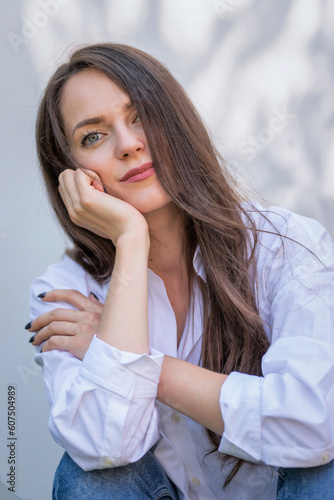 Portrait of young woman with beautiful blue eyes and brunette hair