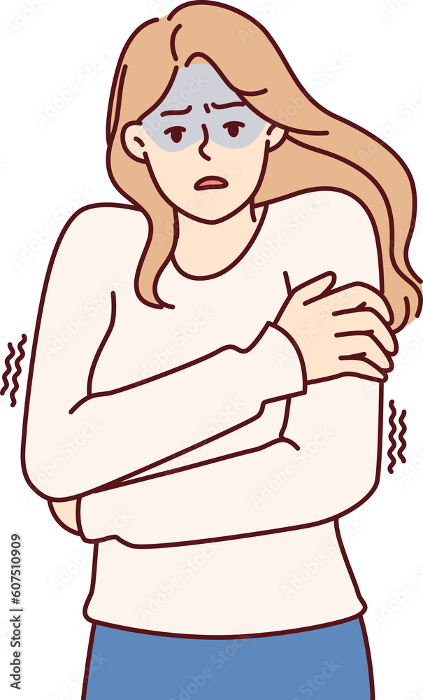 Freezing woman hugging shoulders trying to keep warm and feeling chills after contracting flu Freezing woman hugging shoulders trying to keep warm and feeling chills after contracting flu