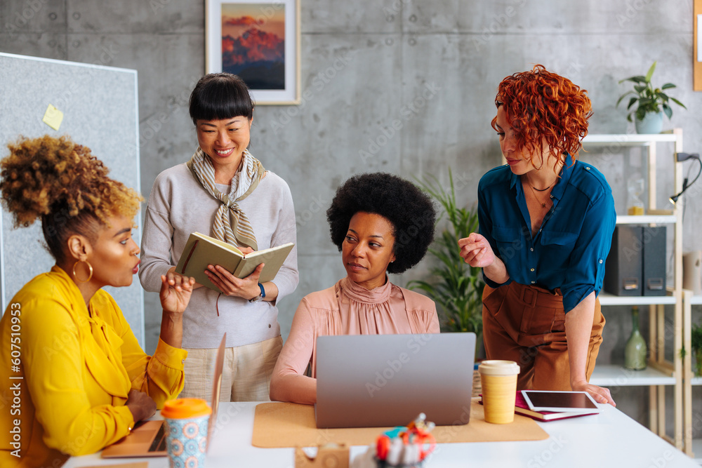 Obraz premium Diverse female collective having boardroom meeting
