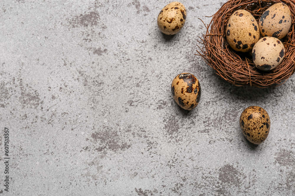Nest with fresh quail eggs on grunge background Nest with fresh quail eggs on grunge background