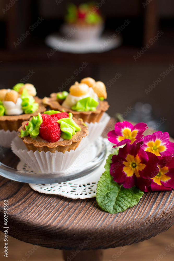 Sweet dessert on display in vintage style on a wooden stand. Rustic pastry shop style