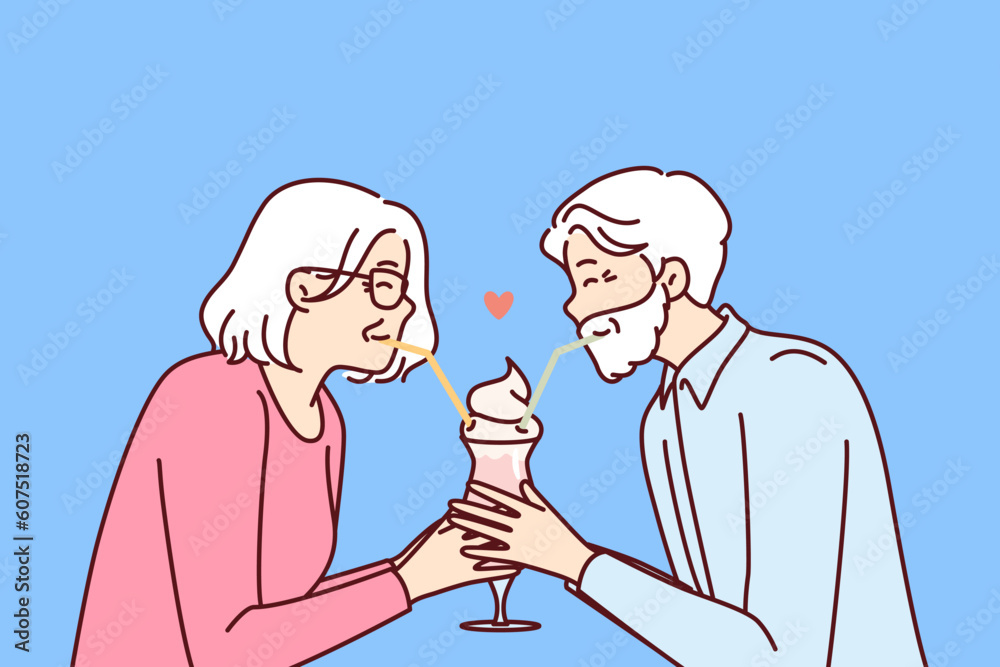 Elderly romantic couple drinking cocktail from straws together enjoying retirement and dating on eve of february 14th Valentine day. Romantic grandparents show love between elderly Elderly romantic couple drinking cocktail from straws together enjoying retirement and dating on eve of february 14th Valentine day. Romantic grandparents show love between elderly