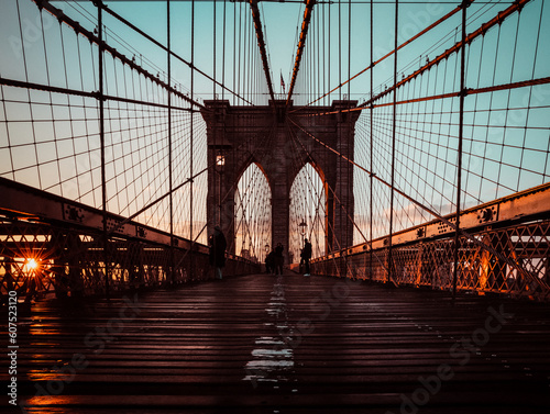 silhouette of a tourist on the Brooklyn Bridge in New York city