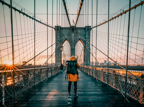 silhouette of a tourist on the  Brooklyn Bridge in New York city © Agata Kadar