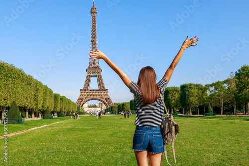 Photography Tourist woman and Eiffel tower in Paris, France, Europe in summer