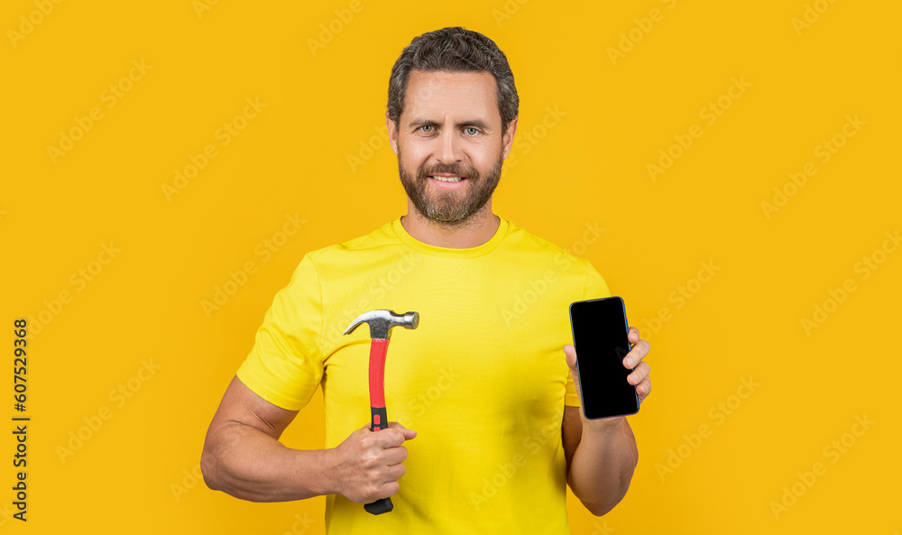 happy man hack the phone isolated on yellow. man hack the phone on background. happy man hack the phone isolated on yellow. man hack the phone on background.