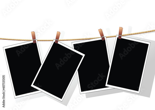 Photo templates hanged on a rope over white background